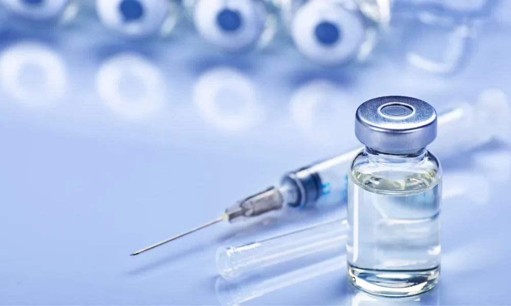 Close-up of IM Booster vial and syringe, healthcare supplies in Torrance, CA